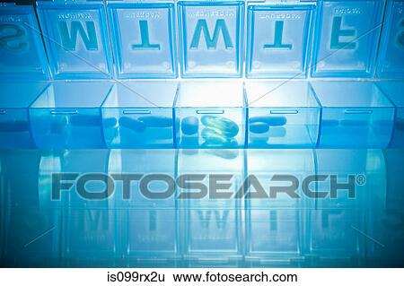 Stock Photograph - Pills in pillbox. Fotosearch