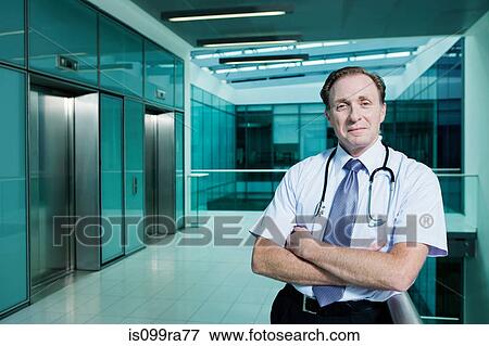 Portrait of doctor with arms folded View Large Photo Image Stock Photo - Portrait of doctor with arms folded. Fotosearch