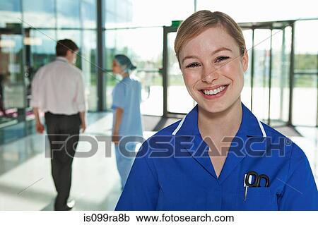 Portrait of nurse in hospital foyer View Large Photo Image Stock Image - Portrait of nurse in hospital foyer. Fotosearch