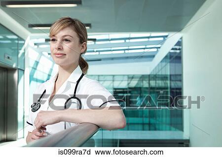 Portrait of nurse leaning on railing View Large Photo Image Stock Image - Portrait of nurse leaning on railing. Fotosearch