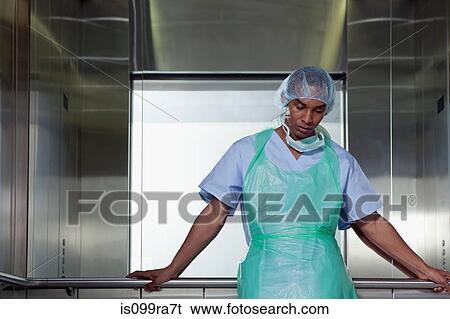 Portrait of surgeon in hospital elevator View Large Photo Image Stock Photograph - Portrait of surgeon in hospital elevator. Fotosearch