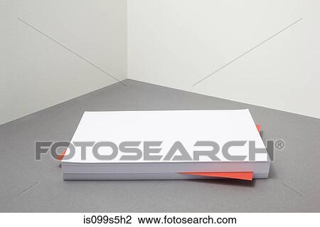 Stock Image - Red piece of paper amongst stack of blank paper. Fotosearch