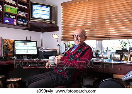 Stock Photo - Senior man in his home office. Fotosearch