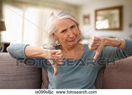 Senior woman with thumbs down View Large Photo Image Stock Image - Senior woman with thumbs down. Fotosearch