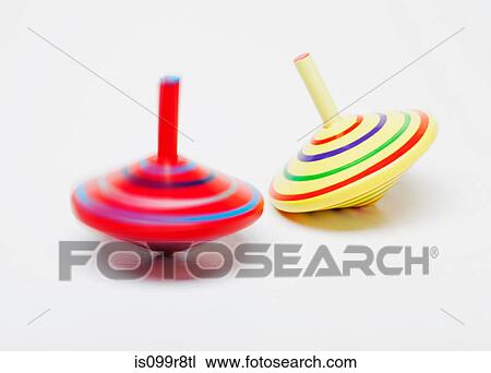Stock Image - Spinning tops in motion. Fotosearch