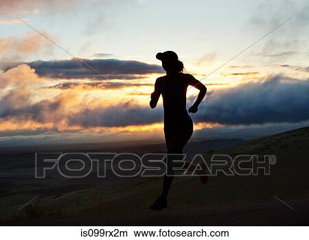 Picture - Woman running outside, silhouette. Fotosearch