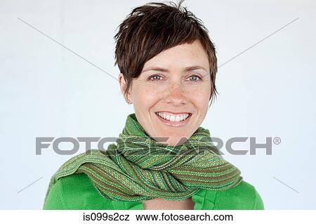 Stock Photo - Woman wearing green scarf, portrait. Fotosearch