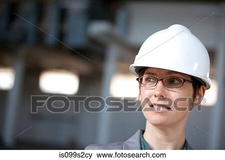 Woman wearing hardhat View Large Photo Image Stock Photo - Woman wearing hardhat. Fotosearch