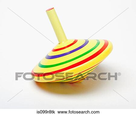 Yellow spinning top View Large Photo Image Stock Image - Yellow spinning top. Fotosearch