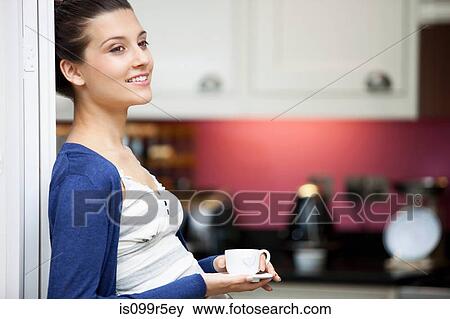 Young woman with espresso cup View Large Photo Image Stock Photo - Young woman with espresso cup. Fotosearch