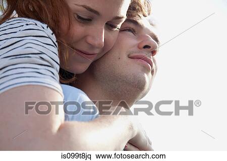Affectionate young couple, close up View Large Photo Image Stock Photography - Affectionate young couple, close up. Fotosearch