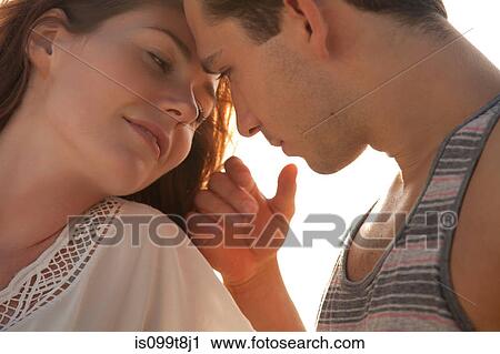 Affectionate young couple, portrait View Large Photo Image Stock Image - Affectionate young couple, portrait. Fotosearch