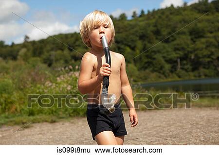 Boy pretending snorkel is instrument View Large Photo Image Stock Photograph - Boy pretending snorkel is instrument. Fotosearch