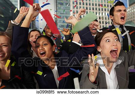 Businesspeople cheering as ticker tape falls View Large Photo Image Stock Photography - Businesspeople cheering as ticker tape falls. Fotosearch