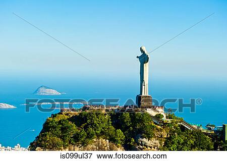 Stock Photo - Christ the Redeemer statue overlooking Rio de Janeiro, Brazil. Fotosearch