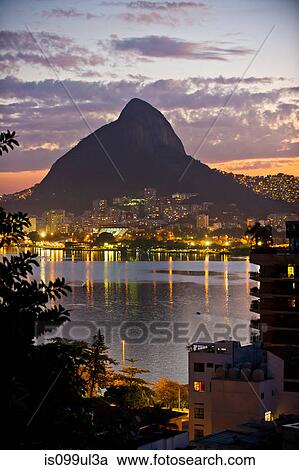 Stock Image - City lights, Lagoa and Morro Dois Irmaos, Rio de Janeiro, Brazil. Fotosearch