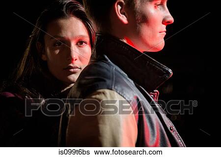 Close up of couple outdoors at night View Large Photo Image Stock Photograph - Close up of couple outdoors at night. Fotosearch