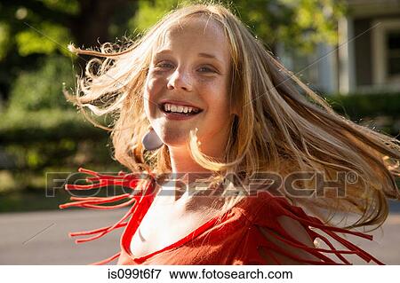 Close up portrait of blonde girl looking at camera smiling View Large Photo Image Stock Photo - Close up portrait of blonde girl looking at camera smiling. Fotosearch