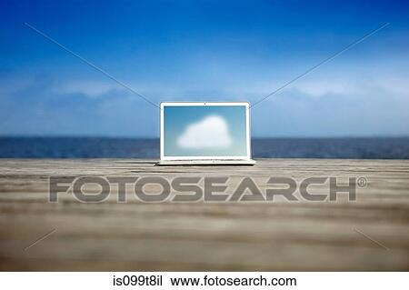 Cloud symbol on a laptop on a pier View Large Photo Image Stock Image - Cloud symbol on a laptop on a pier. Fotosearch