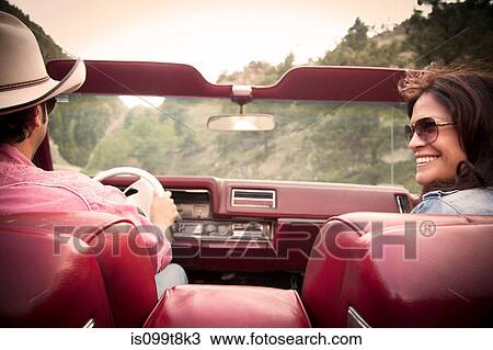 Couple in a convertible car View Large Photo Image Stock Image - Couple in a convertible car. Fotosearch