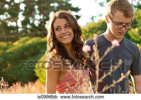 Stock Image - Couple in field. Fotosearch