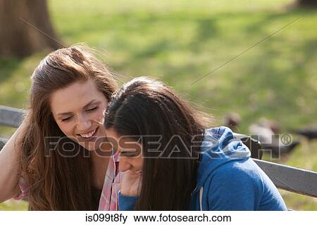 Stock Photo - Female friends in a park. Fotosearch