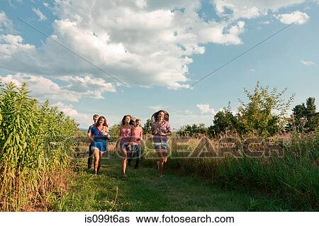 Five friends running through field View Large Photo Image Stock Photograph - Five friends running through field. Fotosearch