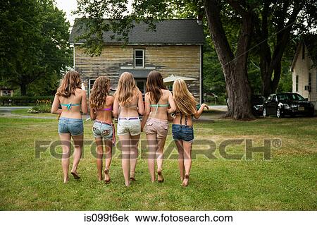 Five girls wearing bikini tops and shorts, rear view View Large Photo Image Stock Image - Five girls wearing bikini tops and shorts, rear view. Fotosearch