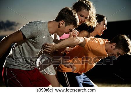 Friends playing soccer at night View Large Photo Image Stock Image - Friends playing soccer at night. Fotosearch