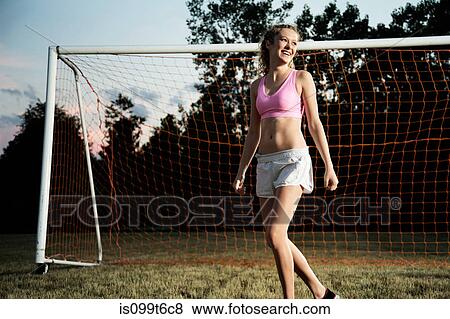 Girl by football goal View Large Photo Image Stock Photo - Girl by football goal. Fotosearch