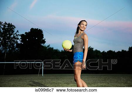Stock Photo - Girl holding soccer ball. Fotosearch