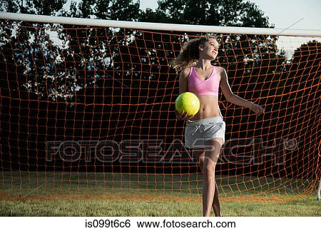 Stock Photograph - Girl holding soccer ball. Fotosearch
