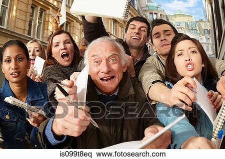 Group of people asking for autographs View Large Photo Image Stock Photography - Group of people asking for autographs. Fotosearch