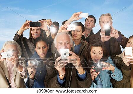 Group of people taking photographs View Large Photo Image Stock Photography - Group of people taking photographs. Fotosearch