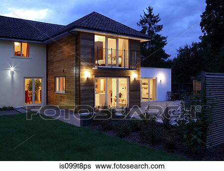 Large house illuminated in the evening View Large Photo Image Stock Photograph - Large house illuminated in the evening. Fotosearch