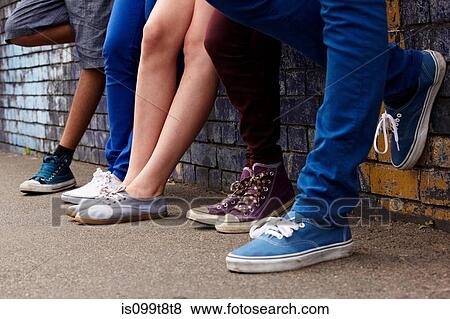 Legs of teenagers standing in a row View Large Photo Image Stock Photo - Legs of teenagers standing in a row. Fotosearch