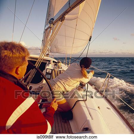 Man and woman sailing yacht together View Large Photo Image Stock Image - Man and woman sailing yacht together. Fotosearch
