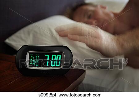 Man reaching for alarm clock View Large Photo Image Stock Image - Man reaching for alarm clock. Fotosearch