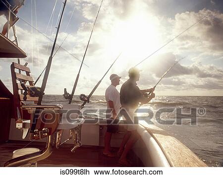 Men fishing from sport fishing boat View Large Photo Image Stock Image - Men fishing from sport fishing boat. Fotosearch