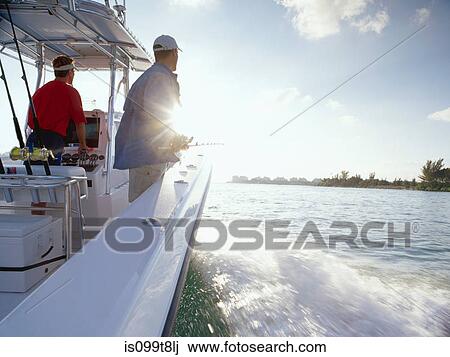 Men fishing from sport fishing boat View Large Photo Image Stock Image - Men fishing from sport fishing boat. Fotosearch