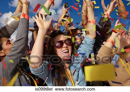 People cheering at a music festival View Large Photo Image Stock Photograph - People cheering at a music festival. Fotosearch