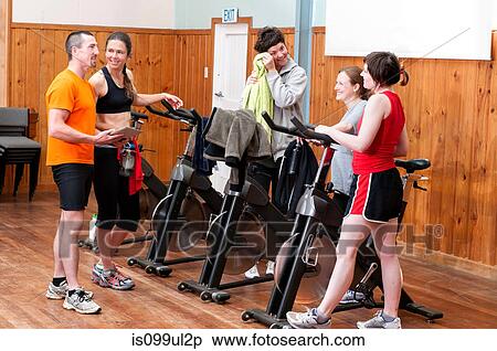 People talking after spinning class View Large Photo Image Stock Photography - People talking after spinning class. Fotosearch