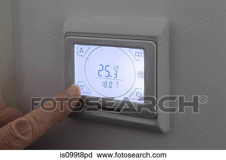 Person adjusting digital thermostat View Large Photo Image Stock Image - Person adjusting digital thermostat. Fotosearch