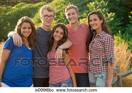 Portrait of five friends with arms around each other View Large Photo Image Stock Image - Portrait of five friends with arms around each other. Fotosearch