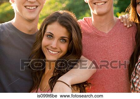 Portrait of friends with arms around each other View Large Photo Image Stock Image - Portrait of friends with arms around each other. Fotosearch