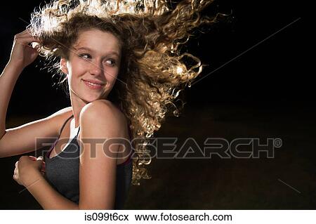 Portrait of girl with hand in hair View Large Photo Image Stock Photo - Portrait of girl with hand in hair. Fotosearch