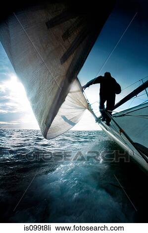 Silhouette of man on sailing boat View Large Photo Image Stock Image - Silhouette of man on sailing boat. Fotosearch