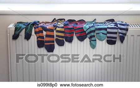 Socks drying on radiator View Large Photo Image Stock Image - Socks drying on radiator. Fotosearch