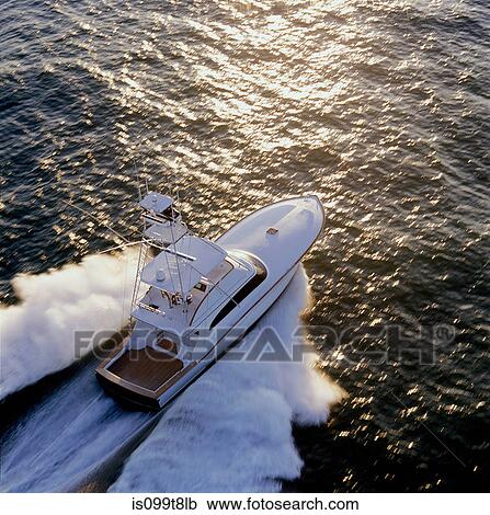 Sports fishing boat sailing through sea View Large Photo Image Stock Image - Sports fishing boat sailing through sea. Fotosearch