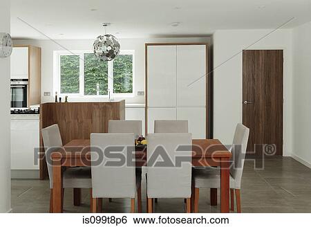 Table and chairs in dining area View Large Photo Image Stock Photograph - Table and chairs in dining area. Fotosearch